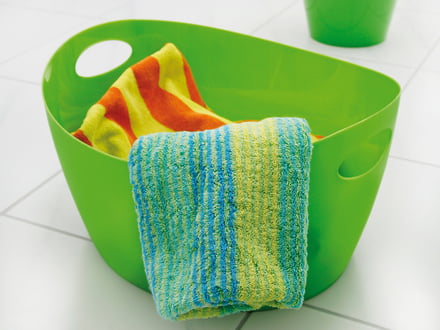 The colourful Bottichelli used as storage for towels in the bathroom