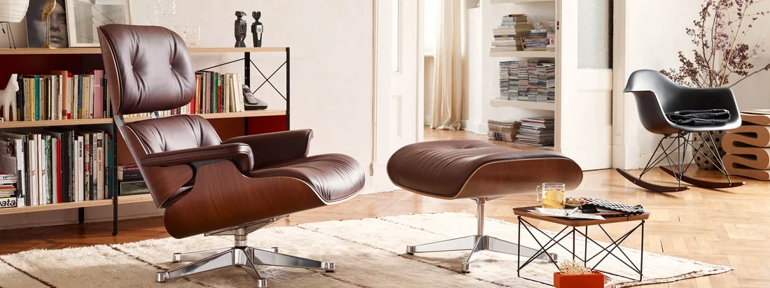 Lifestyle product image: The Lounge Chair by Vitra out of leather was coined by Charles and Ray Eames. The two designers designed the comfortable leather chair for a friend.