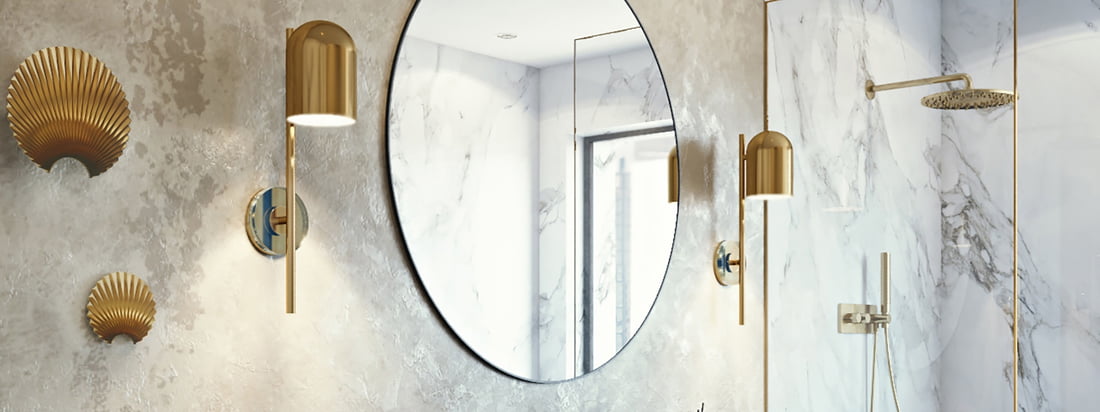 The Luceo wall lamp from AYTM in the ambience view. In a duo, the wall lamp next to a mirror above the wash basin in the bathroom becomes an eye-catcher.