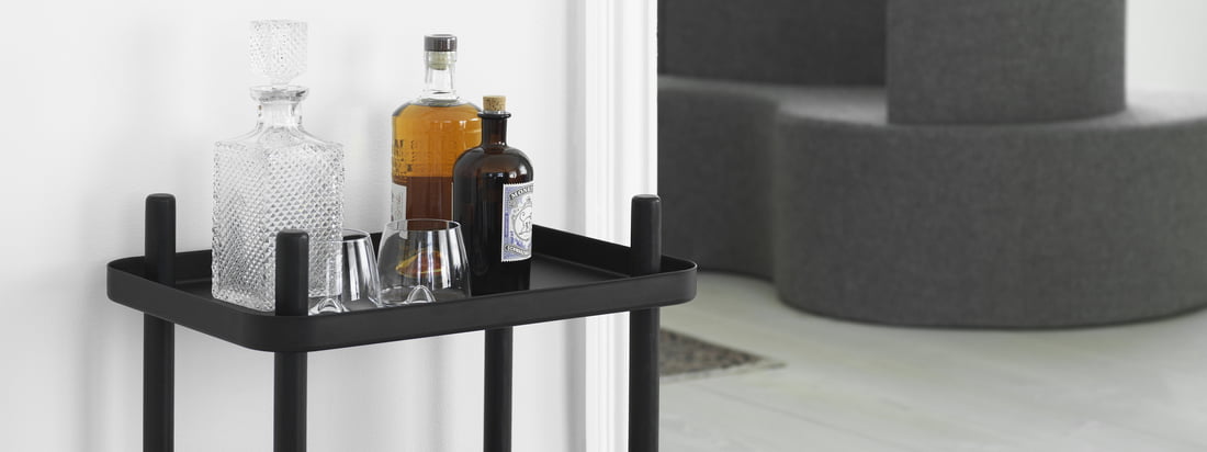 Block side table in black by Normann Copenhagen in the ambience view. The side table can be used for example as a bar trolley and thanks to the wheels can be used anywhere in the ambience.
