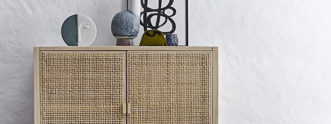 Sanna cabinet from Bloomingville in the ambience view. The cabinet with rattan front is characterized by its light and airy wabi-sabi look and fits perfectly into any ambience.