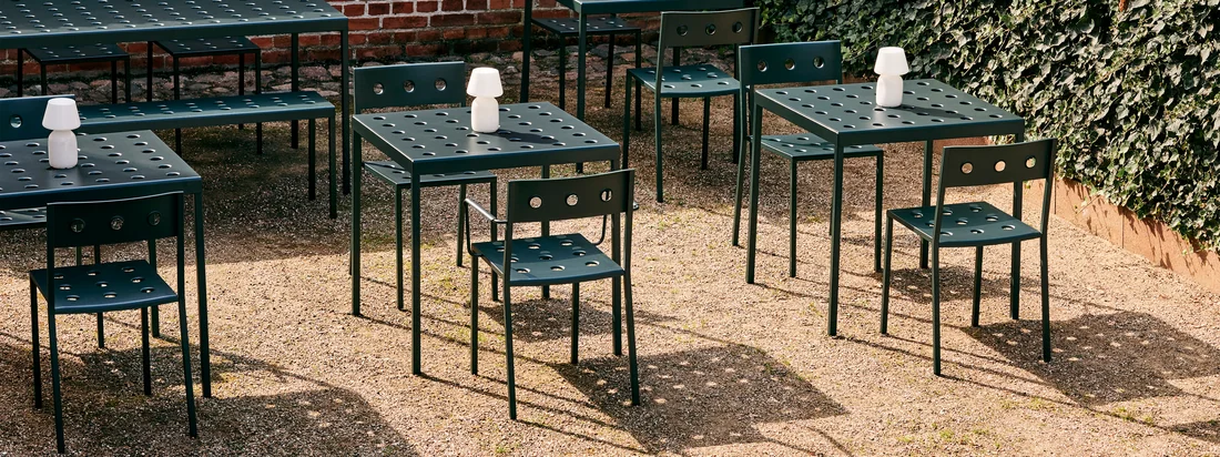 The Balcony outdoor furniture from HAY in the ambience view. The perforated design forms a decorative eye-catcher that makes a grave statement in the interior.