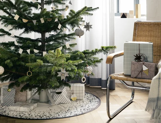 The Christmas spirit is here with the brass ornaments, Christmas tree stand and Christmas tree blanket from ferm Living 