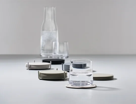 The glass coasters by Zone Denmark in the ambience view: The glass coasters not only protect the table from unsightly scratches and stains, but also set colourful accents.