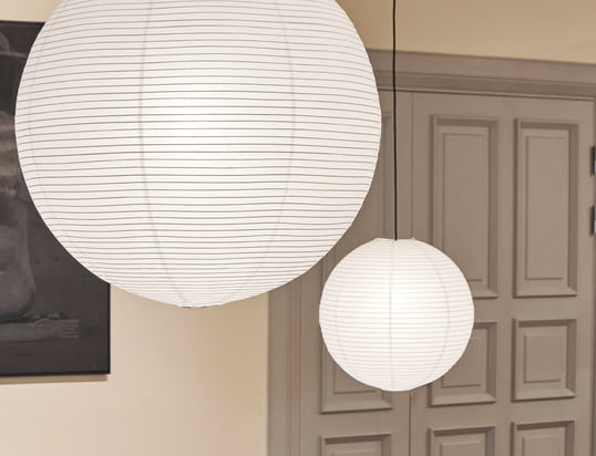 Made of rice paper, the Rice Paper lampshade by Danish manufacturer HAY features a delicate grooved structure that runs lengthwise around the globe-like shade.