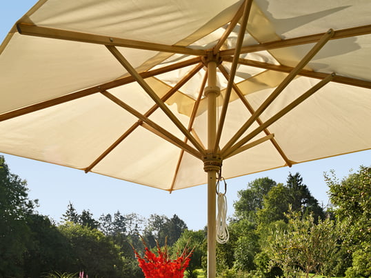 The high-quality parasol from Skagerak is available in several sizes, shapes and materials. The white sails of the parasol provide protection from the sun on hot summer days.