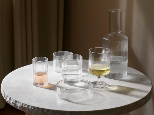 This set of four mouth-blown glasses from the Ripple tableware series by ferm Living is characterized by a beautiful ribbed surface and an individual look, because - each of the glasses in the set has a different shape.