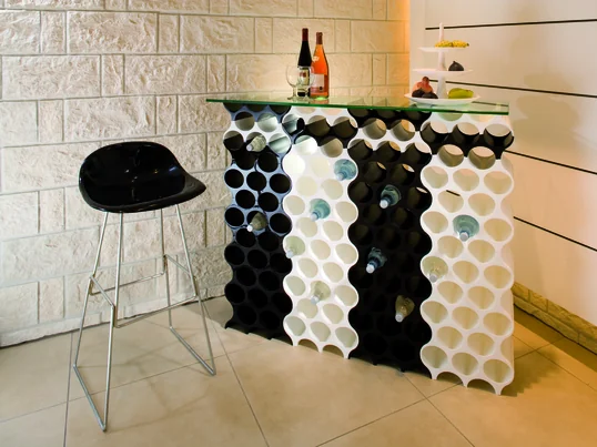 Contrary to spirits, wine should be stored horizontally. This position allows the cork to remain moist so that the wine doesn’t oxidise.