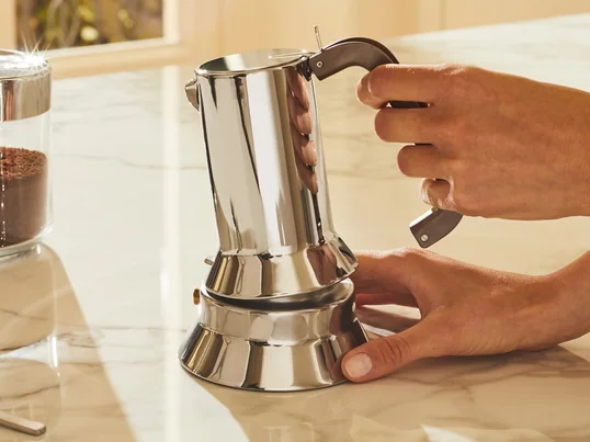 The elegant espresso maker by Alessi enthuses with its distinctive design and the variety of sizes. A matching kettle with a polished stainless steel finish is also available.