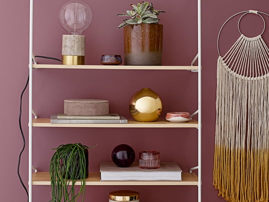 The suede storage boxes, the storage jar set of 2, the storage box Ø 11 x H8 cm and the decorative ball from Bloomingville in the ambience view.