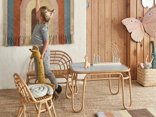 Rainbow series from OYOY in the ambience view. With the chair, bench and table from the Rainbow series, the children get their very own seating area in the living room.