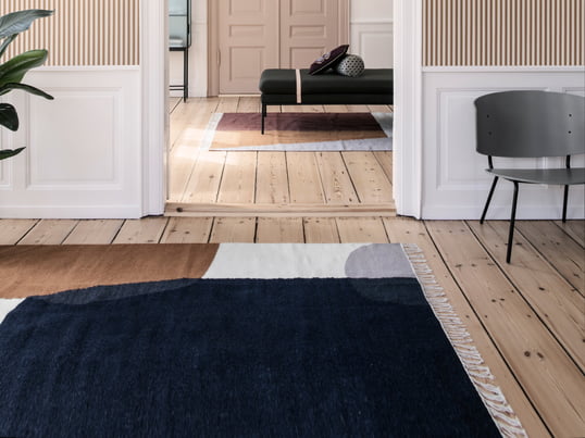 The ferm Living kilim Rug Merge in the ambience view: the carpet is inspired by the colours of nature and creates cosiness in every home.