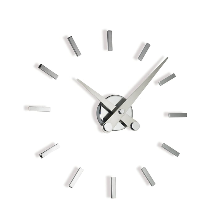 Puntos suspensivos wall clock by nomon with 12 hour marks made of chrome and steel