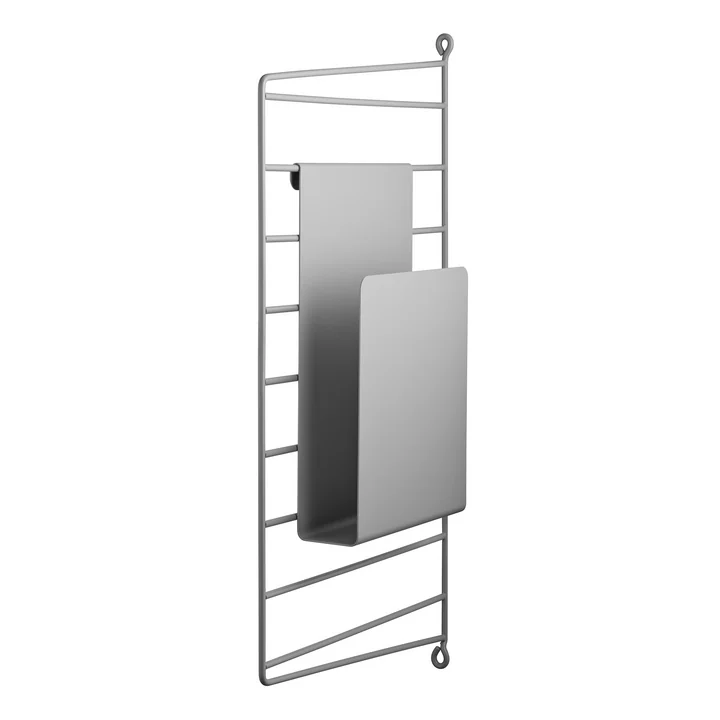 Magazine holder on wall ladder from String