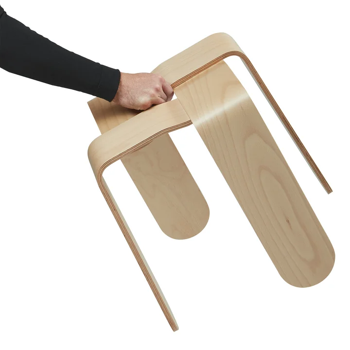 The Criss Cross stool from Frederik Roijé in natural beech is easy to transport