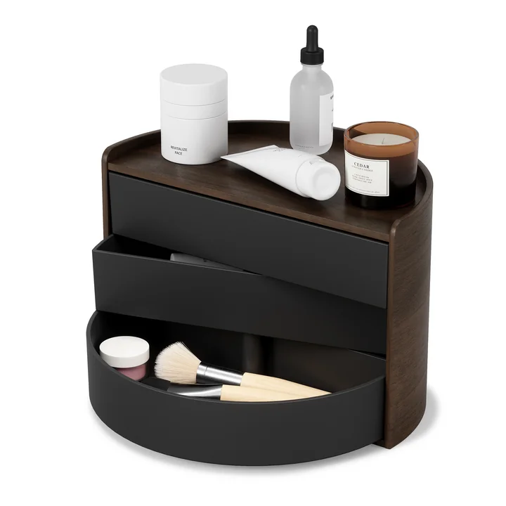 The Moona storage box from Umbra in black / walnut with cosmetic products