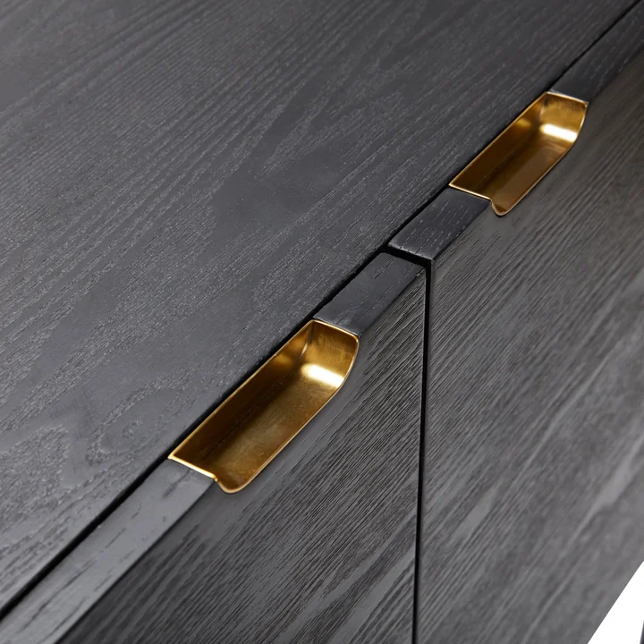 The handles of the chest of drawers with 2 compartments