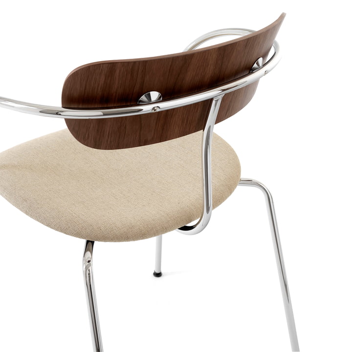 Timeless designer chair with upholstery and armrests