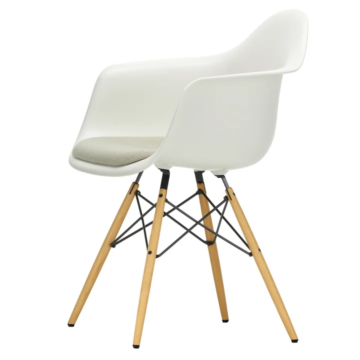 Eames Plastic Armchair DAW with seat cushion from Vitra in honey-colored ash / white (basic dark felt glides)