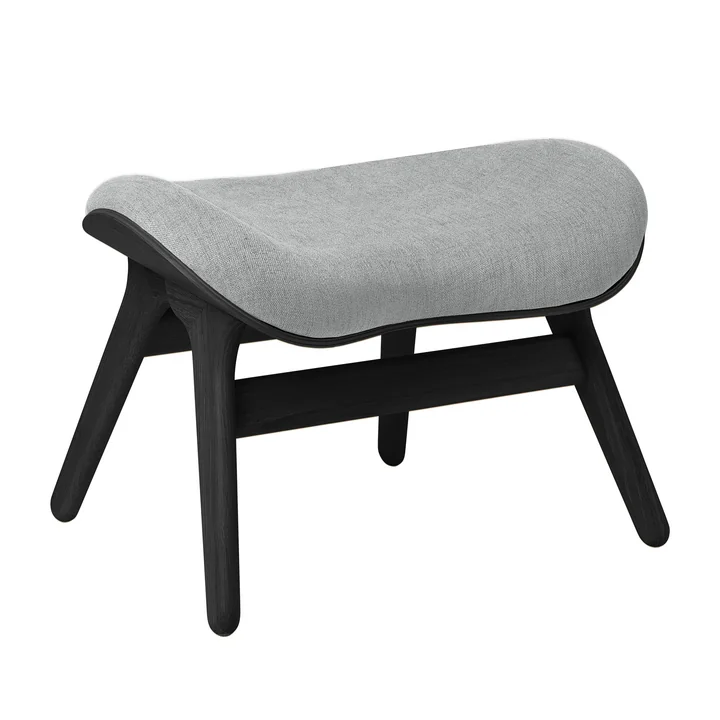 A Conversation Piece Ottoman from Umage in the black oak version / sterling