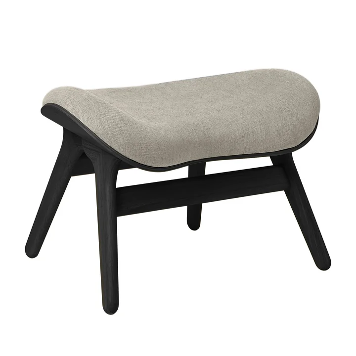 A Conversation Piece Ottoman from Umage in the black oak version / white sands