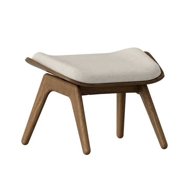 The Reader Ottoman from Umage in the dark oak version / white sands