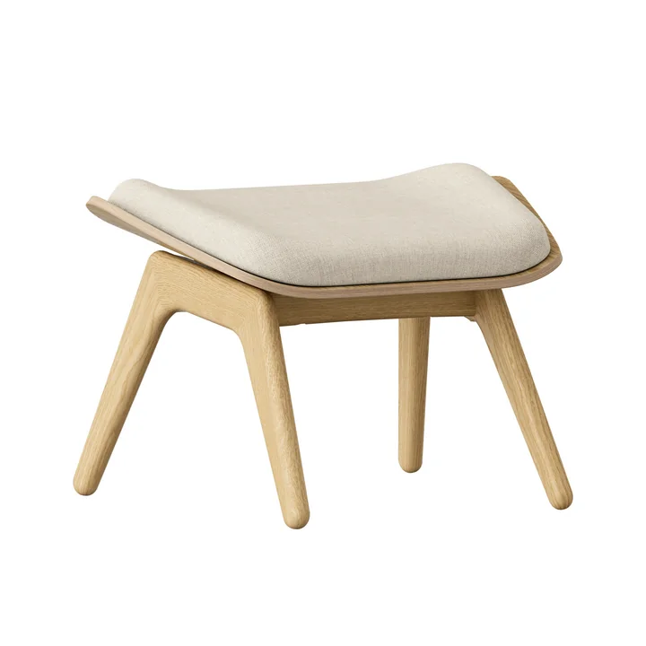 The Reader Ottoman from Umage in the natural oak version / white sands