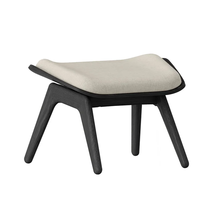 The Reader Ottoman from Umage in the black oak version / white sands