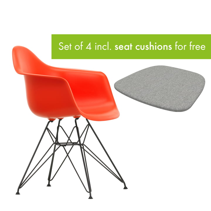 Eames Plastic Armchair DAR from Vitra in the version basic dark / poppy red incl. seat cushion in the version pebble grey