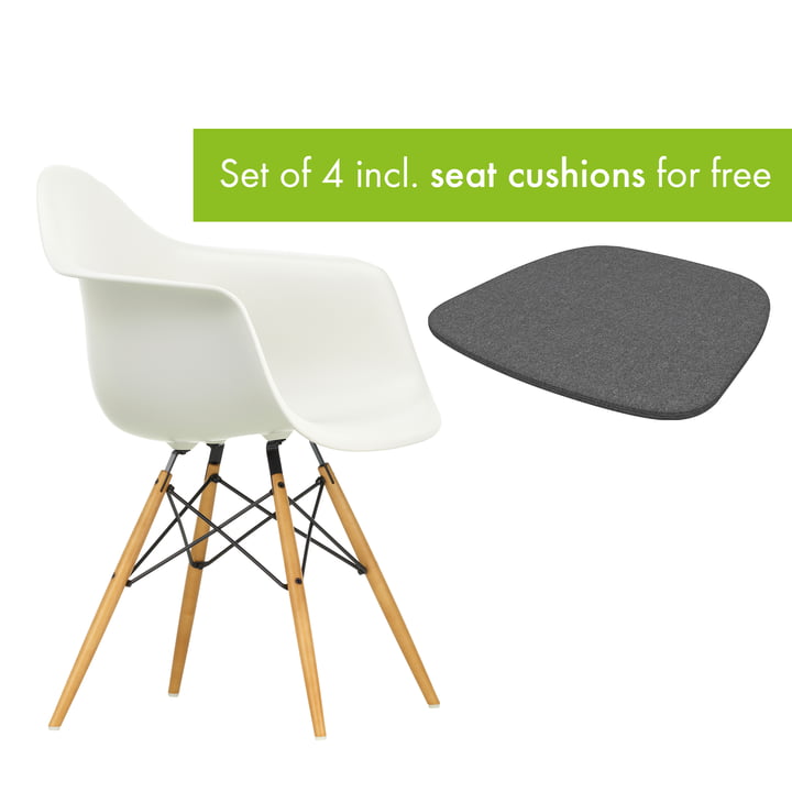 Eames Plastic Armchair DAW from Vitra in the version maple yellowish / white incl. seat cushion in the version classic grey