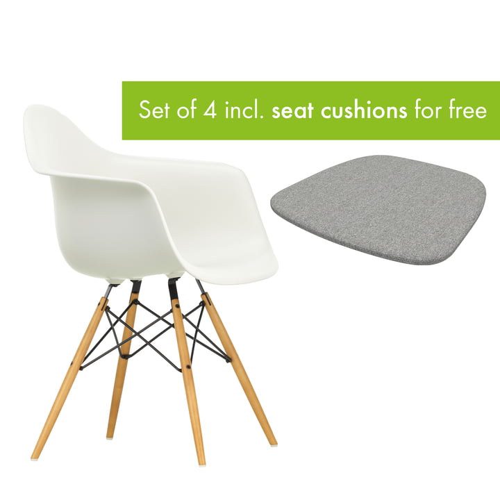 Eames Plastic Armchair DAW from Vitra in the version maple yellowish / white incl. seat cushion in the version pebble grey