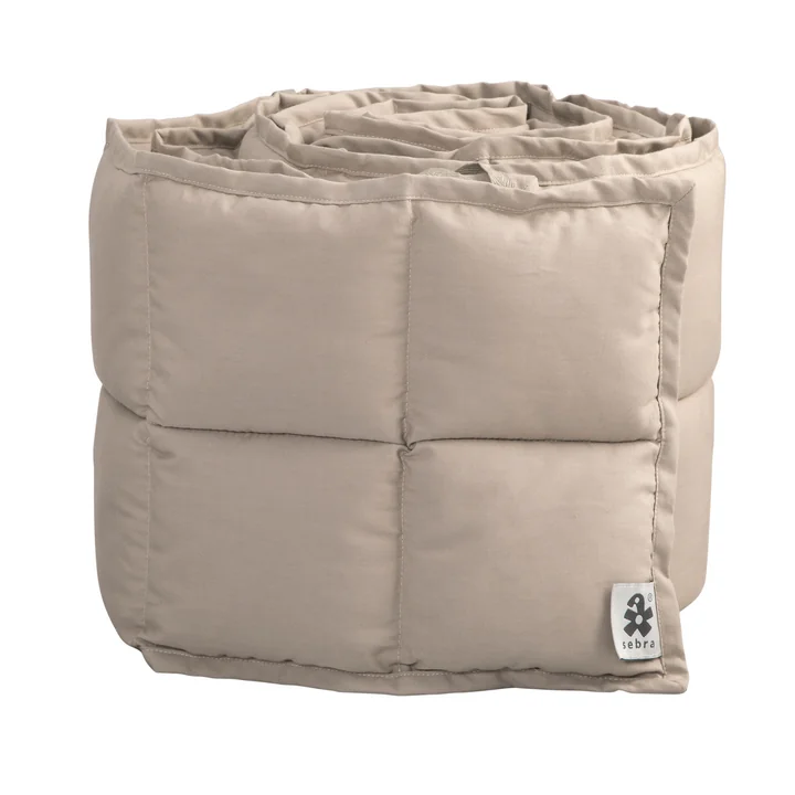 Baby cot bumper from Sebra in the version square quilted / jetty beige