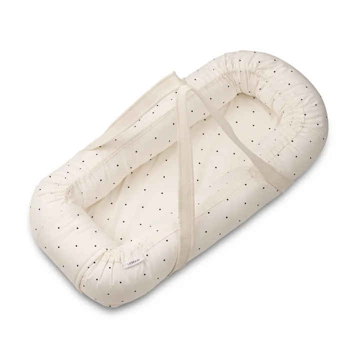 Gro Baby nest / baby carrier from LIEWOOD in the classic dotted, cream de la cream version