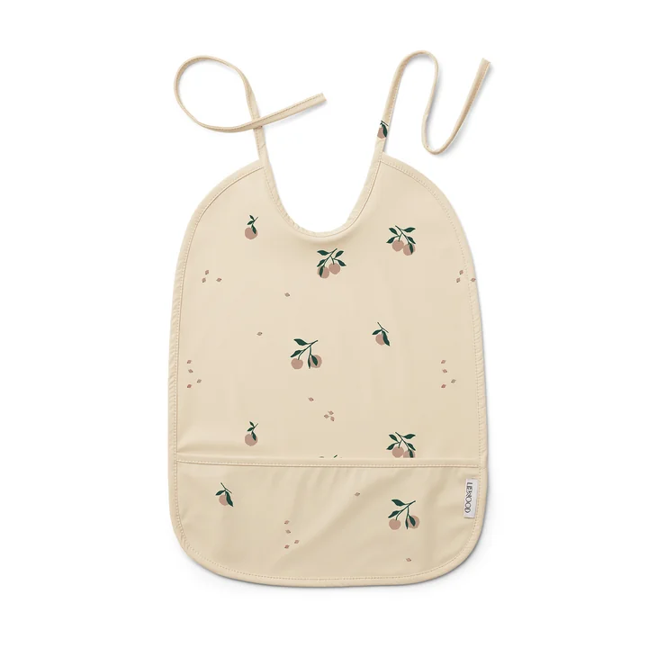 Lai Bib from LIEWOOD in the peach, sea shell version