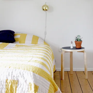 Stool 60 from Artek as a bedside table