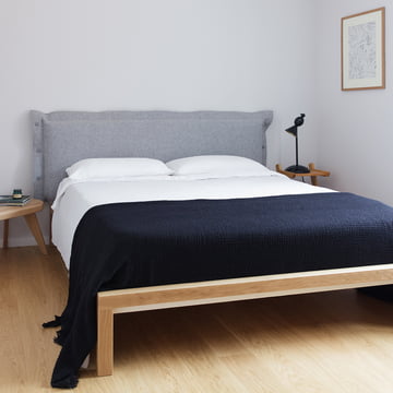 Pure bed with upholstered headboard from Hans Hansen