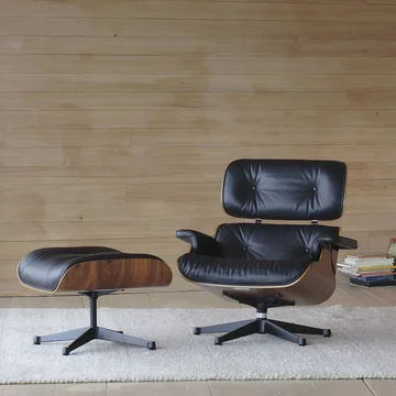 The Lounge Chair with ottoman from Vitra combines elegance with seating comfort