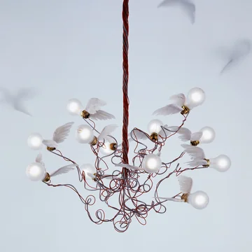 The Birdie pendant lamp, red from Ingo Maurer represents a flock of luminous birds