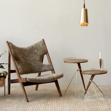 Lounge armchair with sheepskin and side tables in walnut