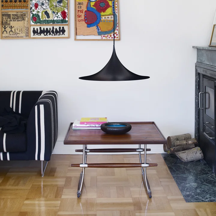 Semi Pendant lamp from Gubi above the coffee table in the living room