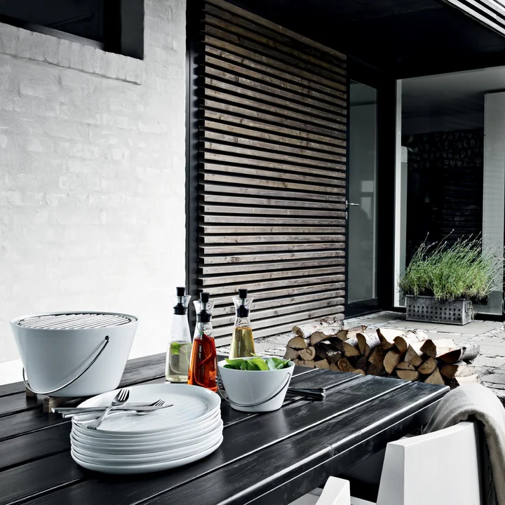 The Eva Solo table grill on a table with barbecue utensils