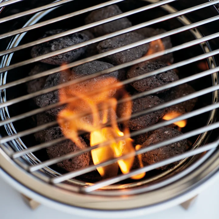 Front view of the Eva Solo Table grill with burning charcoal