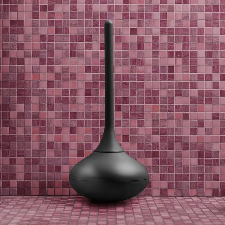 The Ballo Toilet brush from Normann Copenhagen in black before pink tiles