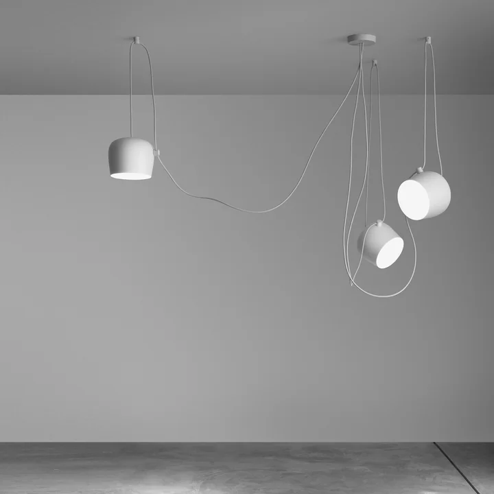 The AIM pendant lights, white, from Flos in combination with each other.