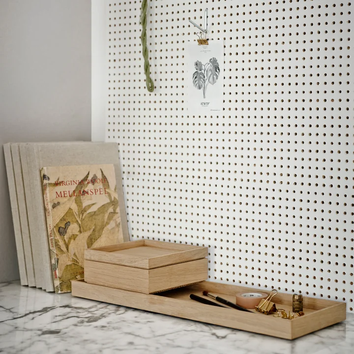 The Nomad Box from Skagerak on a marble surface