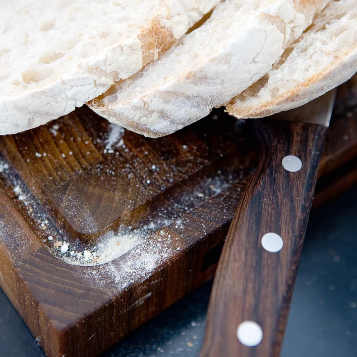 The notch on the cutting board from Skagerak catches crumbs