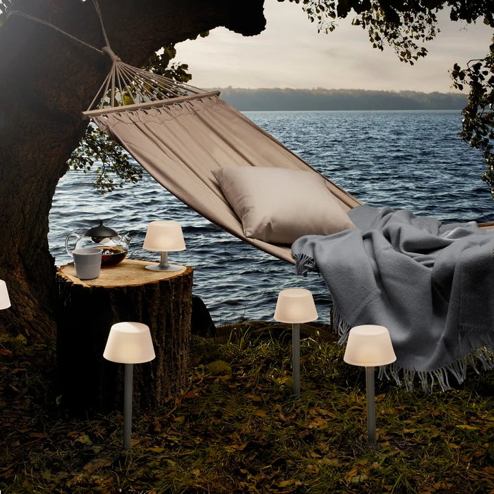 The SunLight garden lamp from Eva Solo next to a hammock by the sea