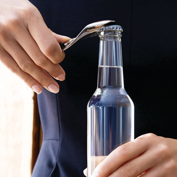 The Bulla bottle opener from Alessi in use