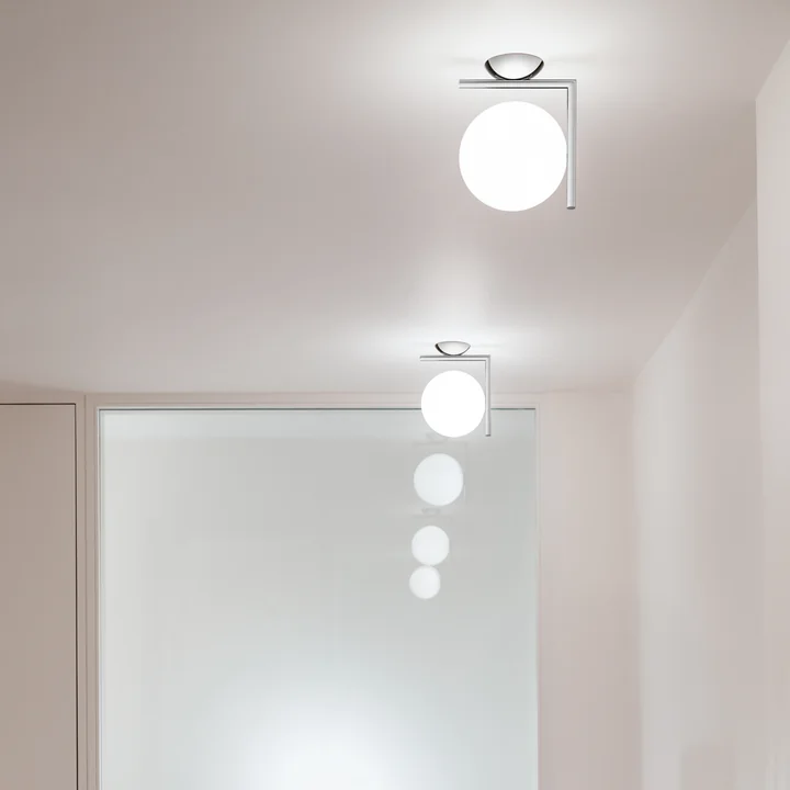 IC wall and ceiling lamp by Flos in chrome hung in a row
