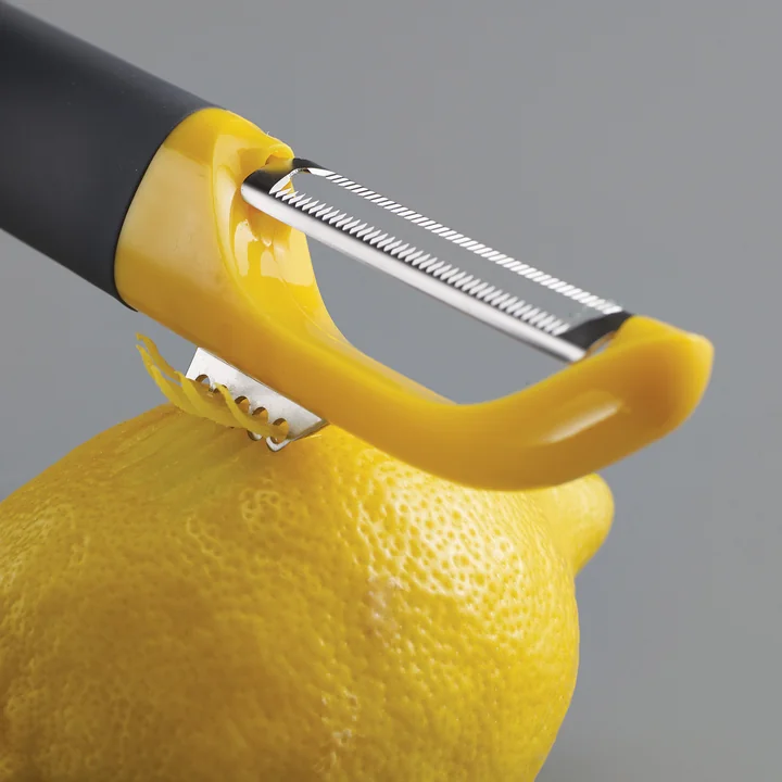 Multi-peel with serrated blade and zest cutter